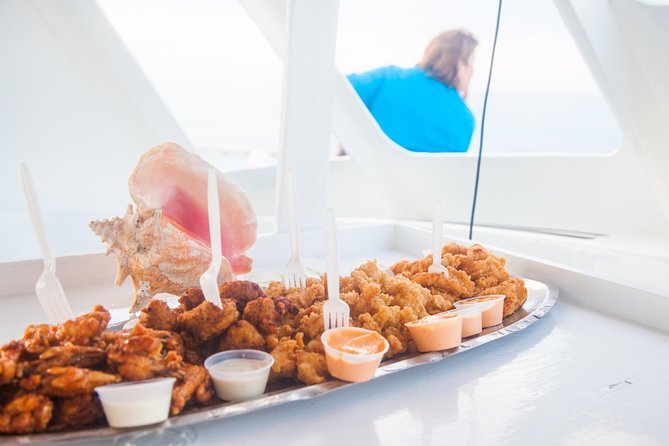 2 Hour Private Sunset Catamaran Sailing Charter from Grace Bay, Providenciales - Local appetizers, cracked conch, and Caribbean drinks