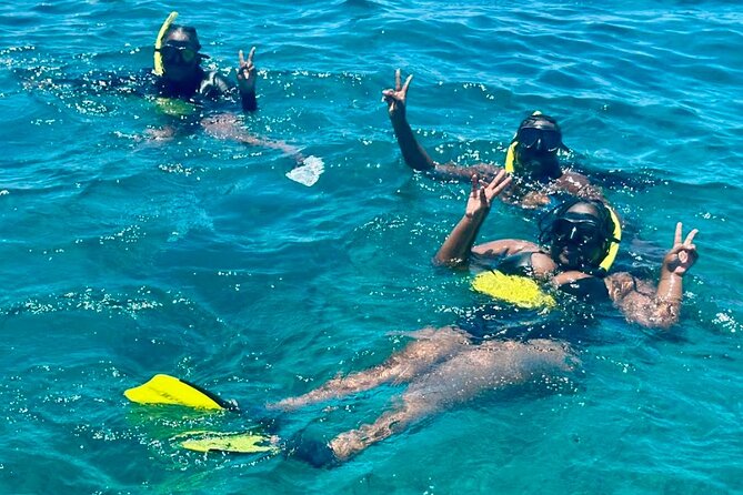 Private Boat Tour with Snorkeling and Beach BBQ - Snorkeling in clear Providenciales water